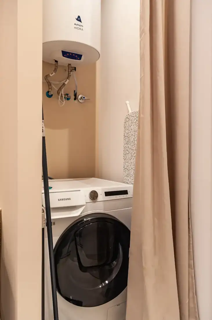 Washing machine behind a curtain
